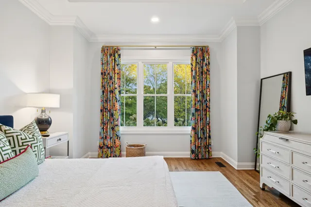 a bedroom with a bed and a flat screen tv in it