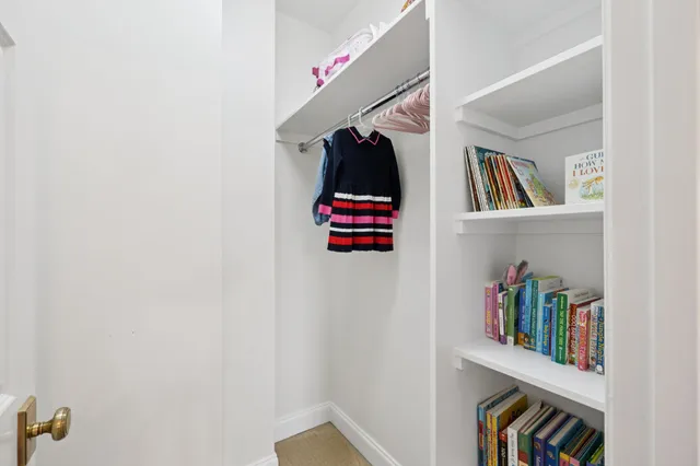 a view of a chair and table in the balcony