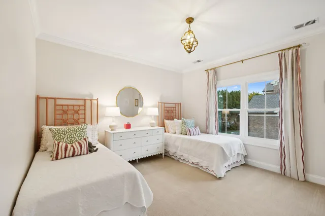 a view of a chair and tables in the balcony