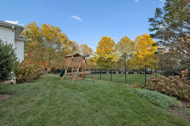a view of a balcony with wooden floor and furniture