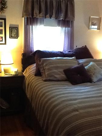 32 Haskell Road Pepperell, MA 01463 - Photo 6 of 18 a bedroom with a bed and a window