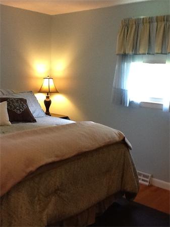 32 Haskell Road Pepperell, MA 01463 - Photo 7 of 18 a bedroom with a bed and a window