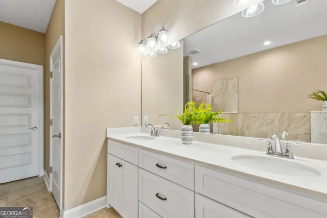 a bathroom with a sink and a mirror
