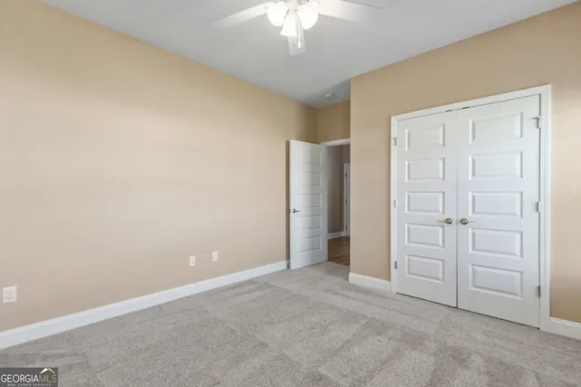 an empty room with closet area