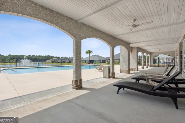 a view of a lake with houses in the background