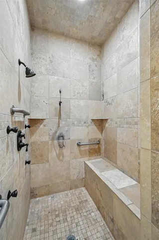 a bathroom with a granite countertop sink vanity mirror and toilet