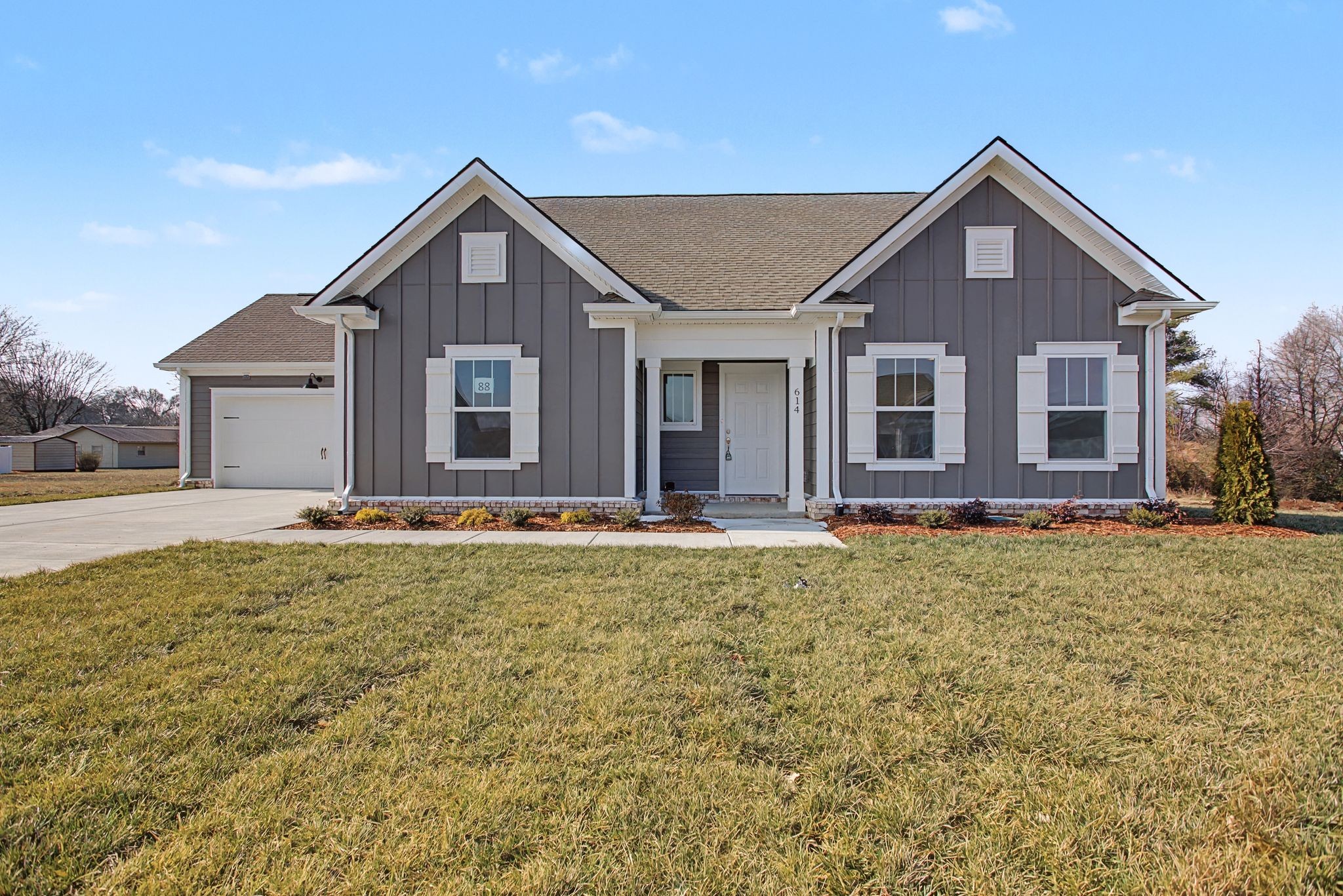 614 Brookside Drive Mount Pleasant, TN 38474 - Photo 2 of 41 a front view of a house with a yard