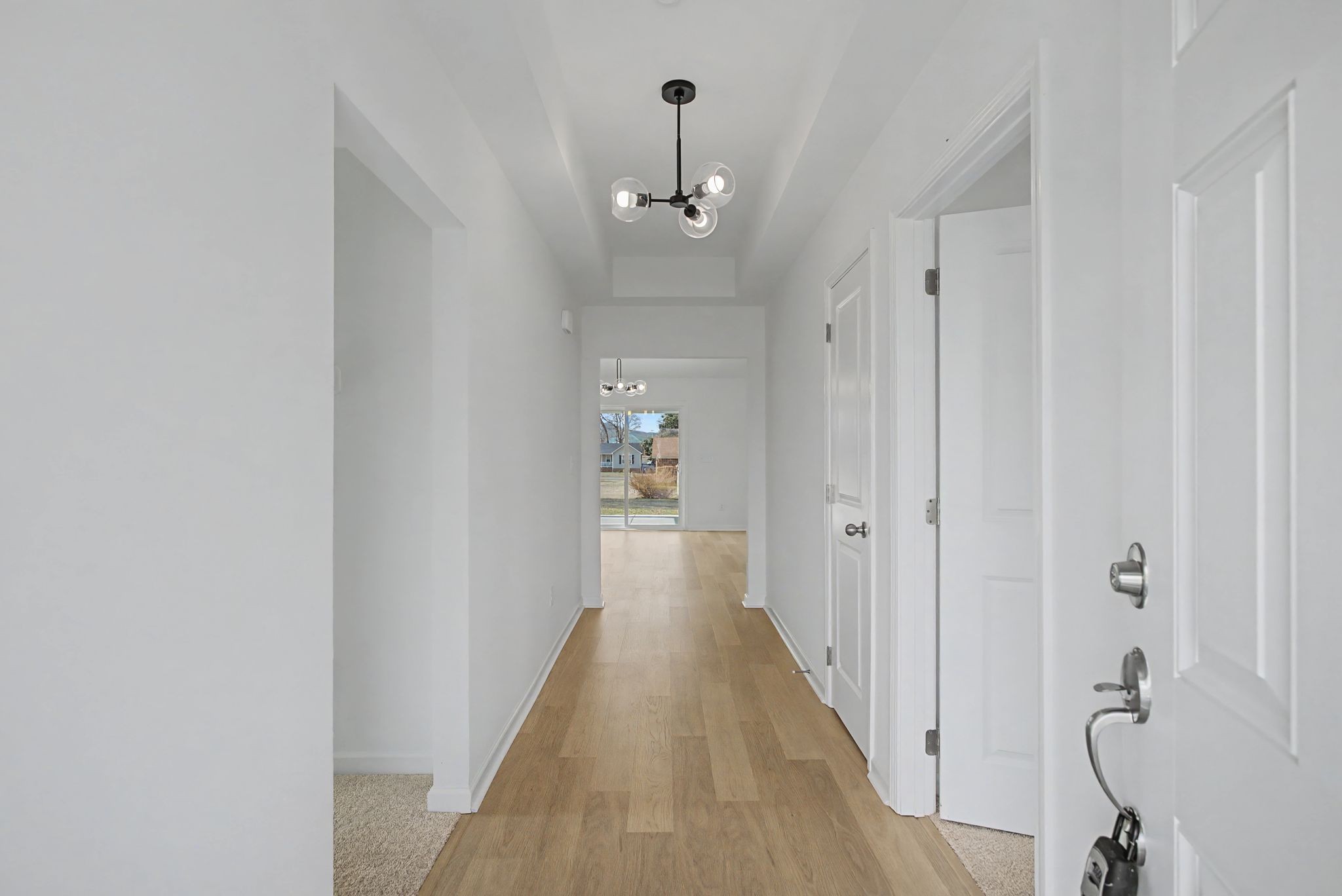 614 Brookside Drive Mount Pleasant, TN 38474 - Photo 8 of 41 a view of a hallway with wooden floor and closet