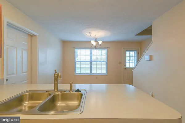 a bathroom with a tub sink and window