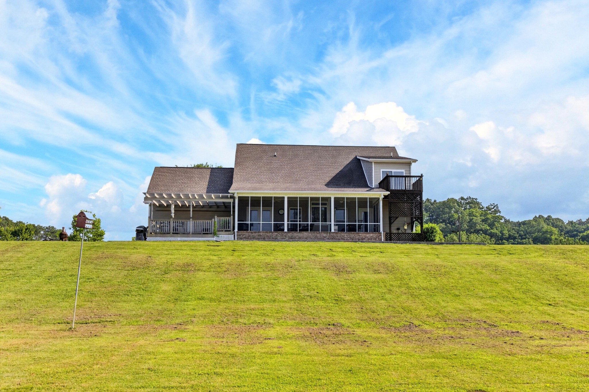 759 Pinhook Road Calhoun, TN 37309 - Photo 5 of 70 a view of a large pool with lawn chairs under an umbrella
