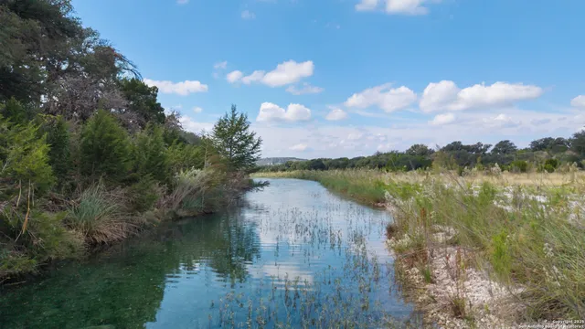 a view of lake with green space