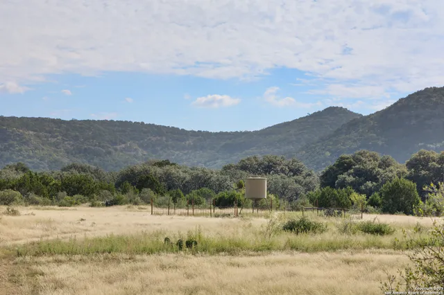an aerial view of mountains in the background
