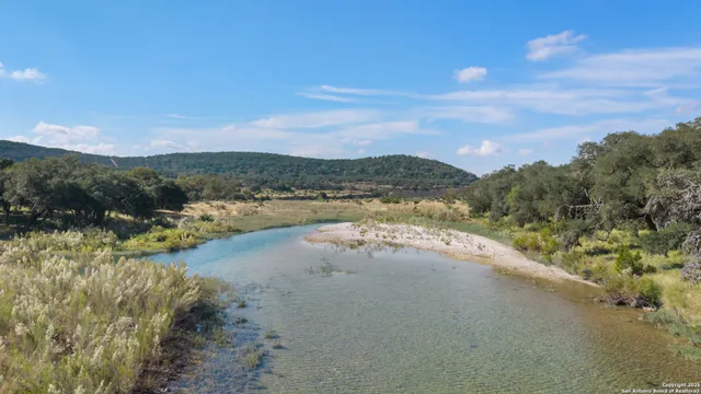 a view of a lake with mountains in the background