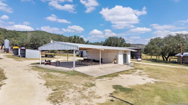 a view of a house with a yard covered in snow
