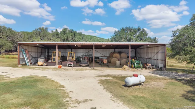 a view of a chair and tables in the patio