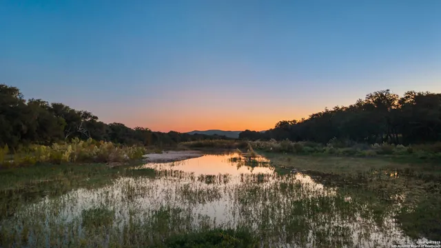 a view of lake with mountain in background