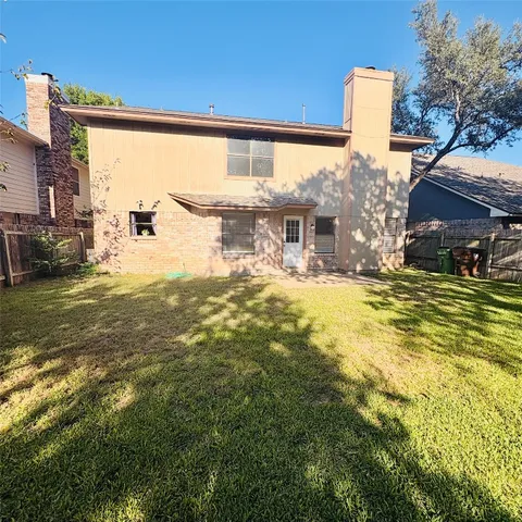 a swimming pool with outdoor seating and yard