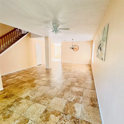 a view of a hallway with a window