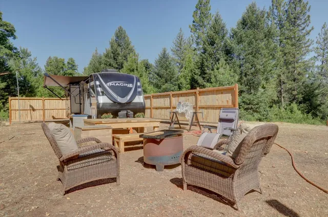 a roof view with sitting space and garden