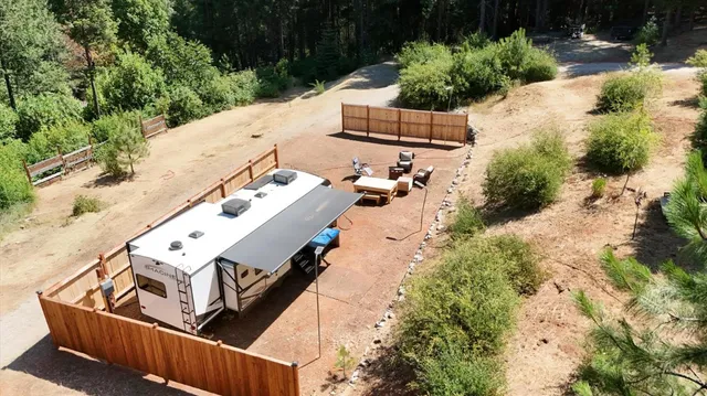 an aerial view of house with yard