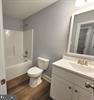 Plum Tree Lane Berkeley Springs, WV 25411 - Photo 14 of 18 a white toilet sitting next to a bath tub