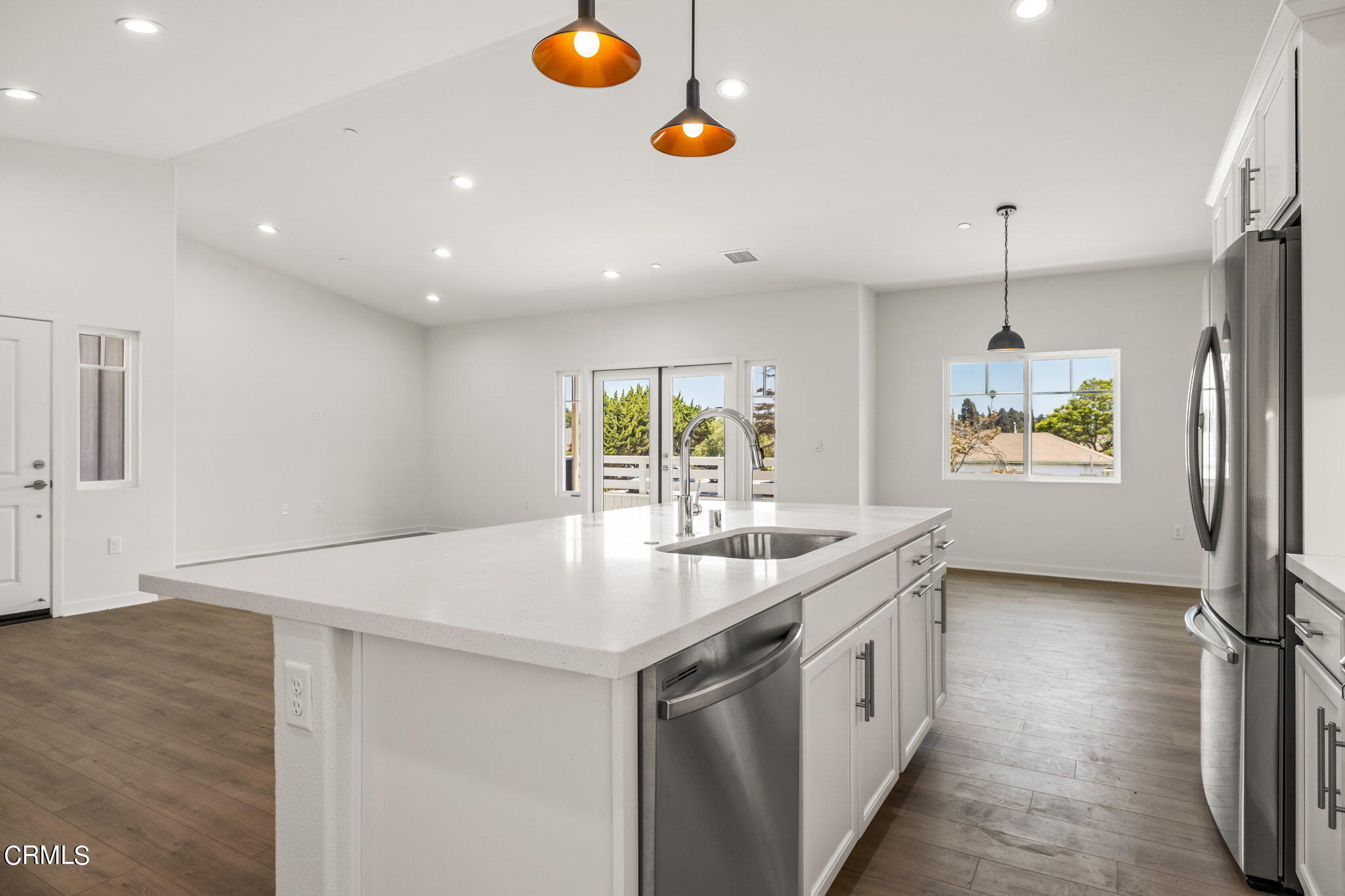 311 North F Street, Unit 202 Oxnard, CA 93030 - Photo 12 of 32 a kitchen with a sink a window and appliances