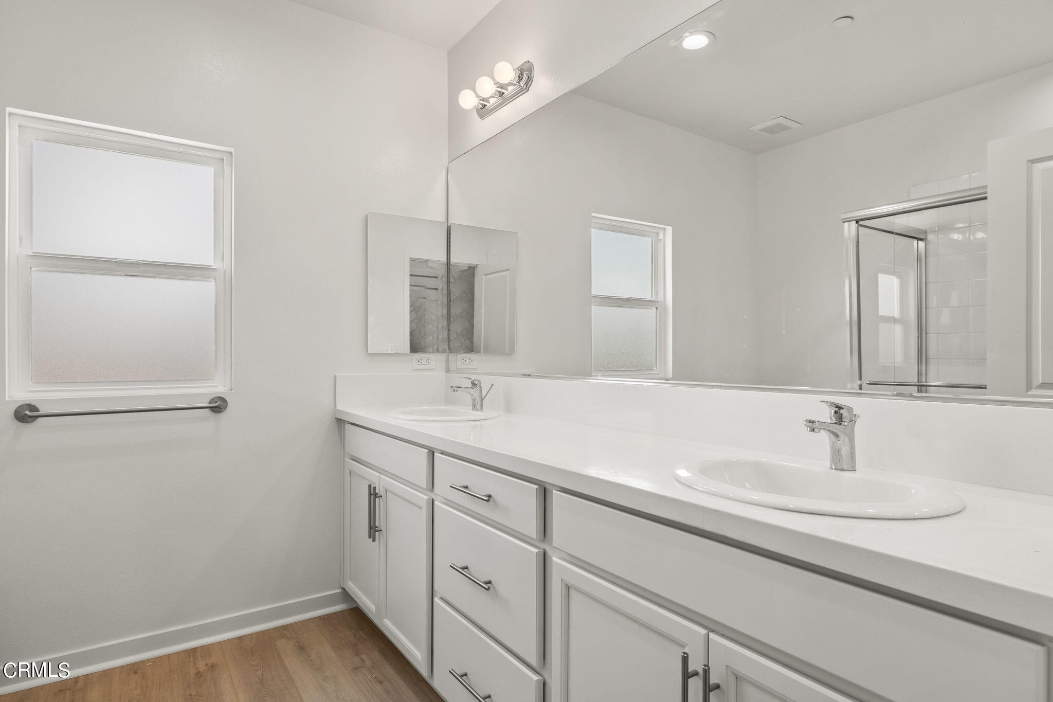 311 North F Street, Unit 202 Oxnard, CA 93030 - Photo 16 of 32 a bathroom with a sink and a mirror