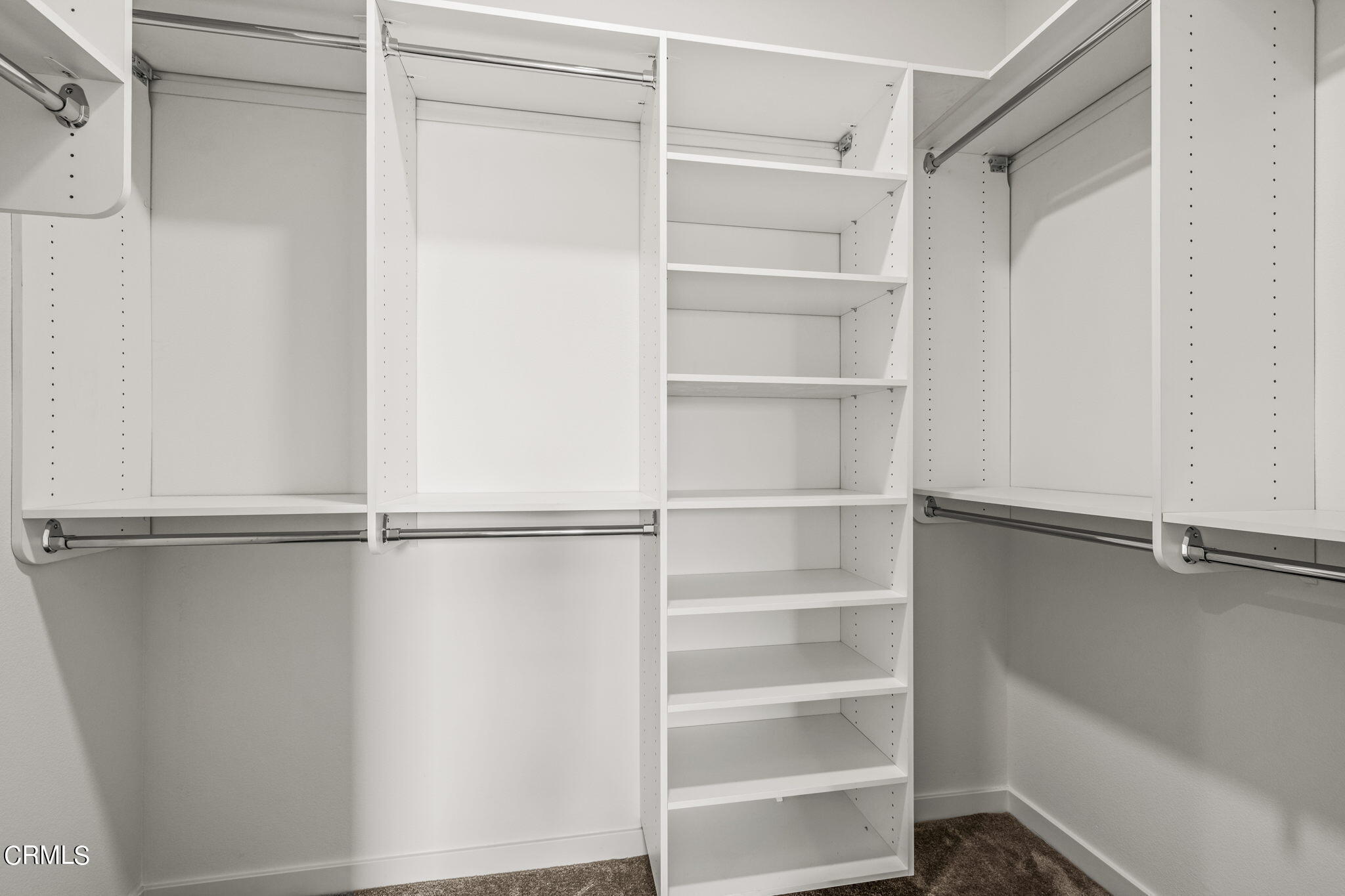 311 North F Street, Unit 202 Oxnard, CA 93030 - Photo 18 of 32 a view of walk in closet with empty racks