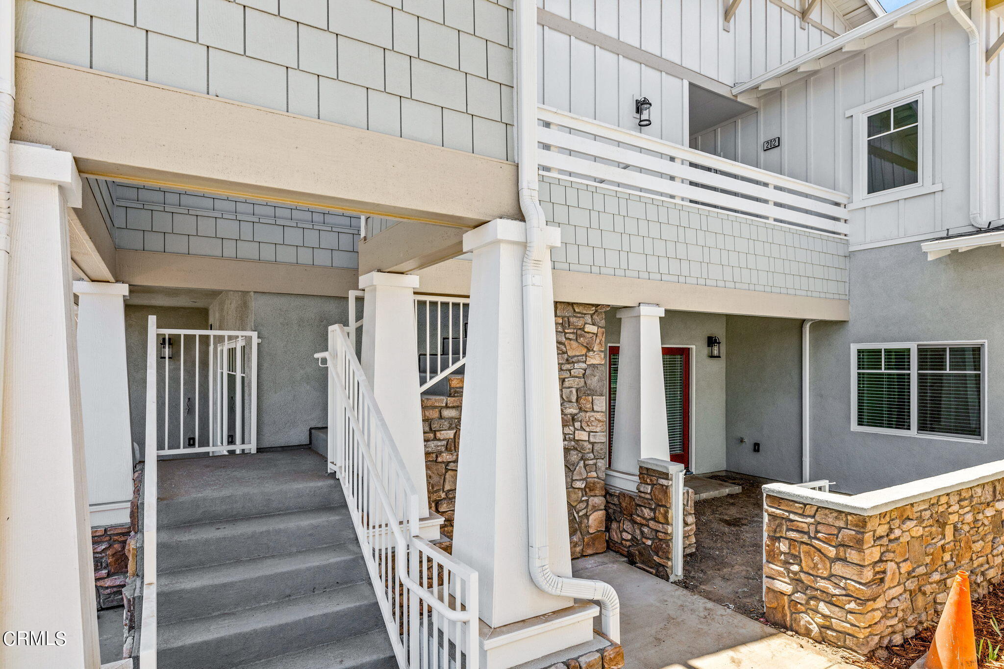 311 North F Street, Unit 202 Oxnard, CA 93030 - Photo 2 of 32 a view of a patio with table and chairs