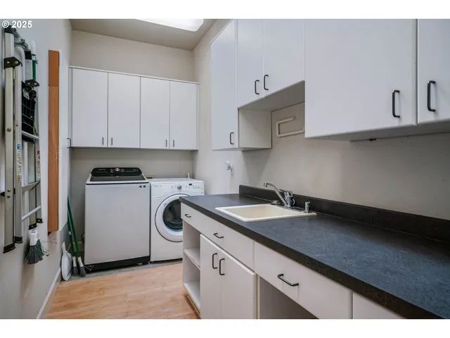 a kitchen with a sink and cabinets