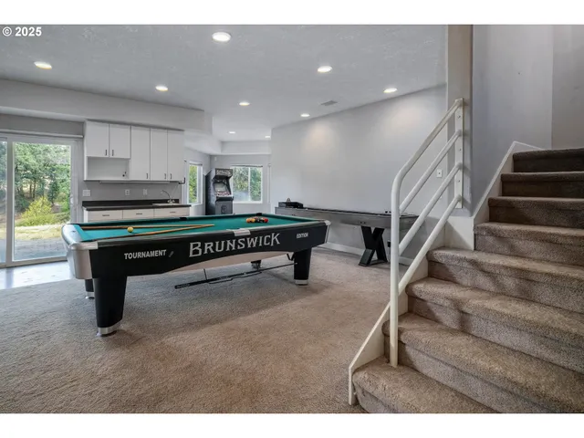 a room with lots of furniture and stairs