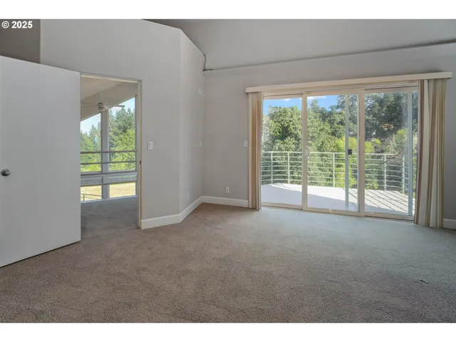 a view of empty room with floor to ceiling window