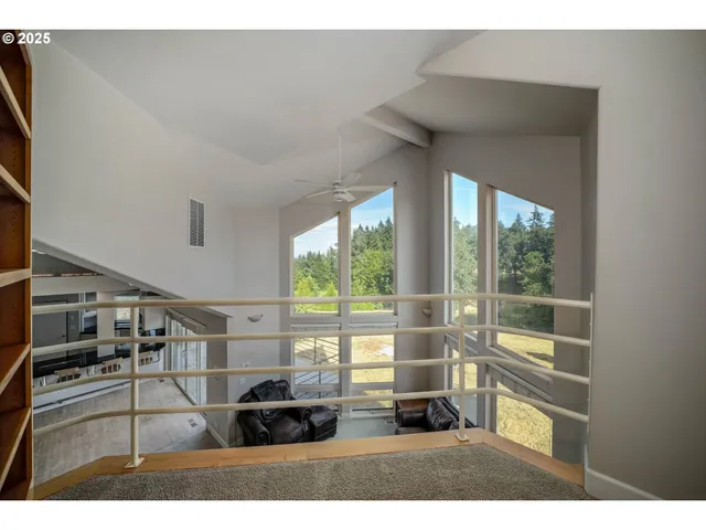 a view of a living room and windows
