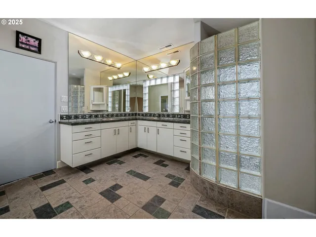 a kitchen with stainless steel appliances granite countertop a sink and cabinets