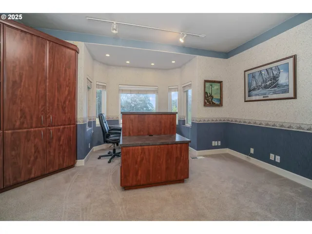 a living room with furniture and a air conditioner vent