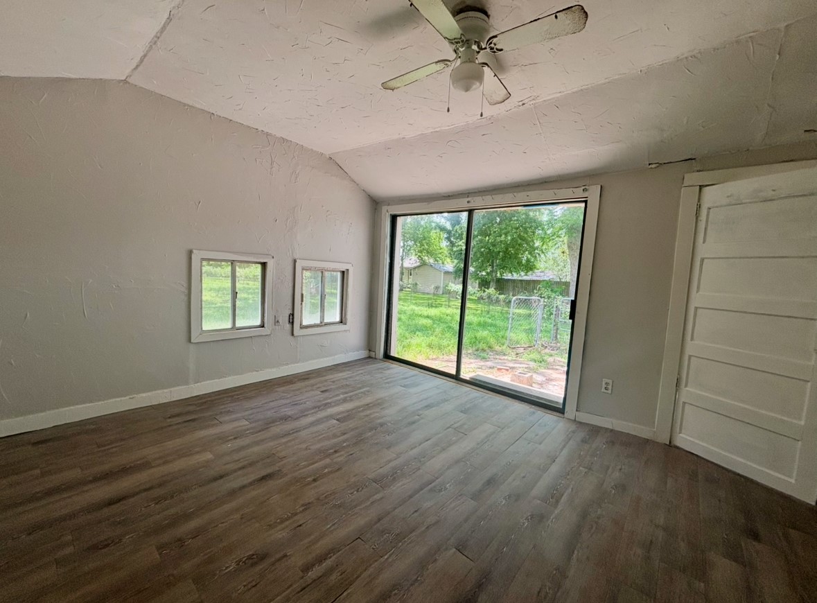 701 North Hackberry Street Sweeny, TX 77480 - Photo 9 of 12 a view of an empty room with a window