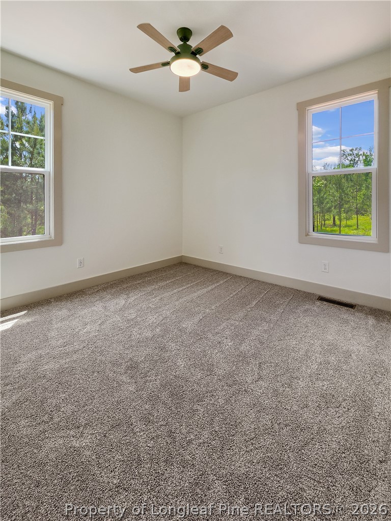 900 Niagara Carthage Road Carthage, NC 28327 - Photo 30 of 38 an empty room with a window and a fan