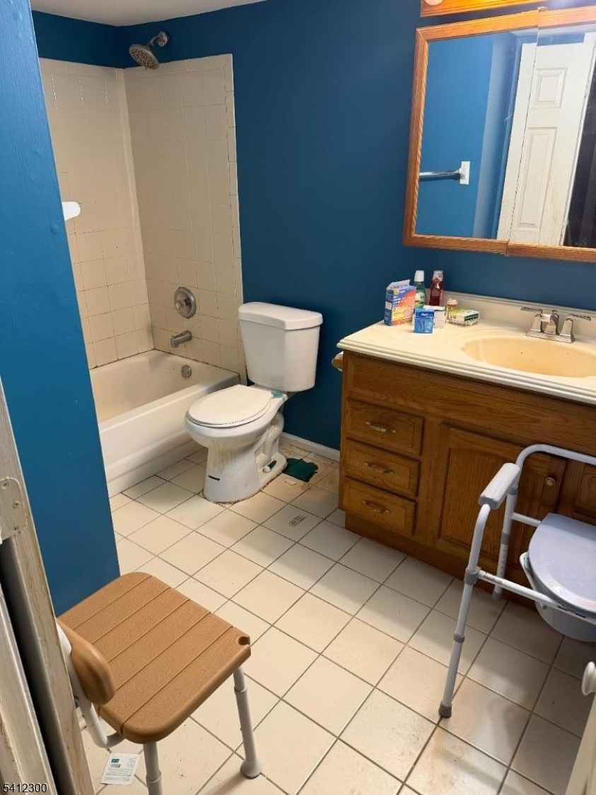 920 Plymouth Road North Brunswick, NJ 08902 - Photo 15 of 17 a bathroom with a sink a toilet and mirror