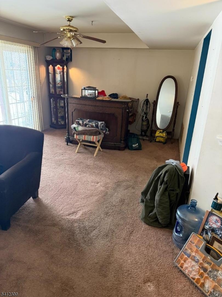 920 Plymouth Road North Brunswick, NJ 08902 - Photo 9 of 13 a view of a livingroom with furniture and a chandelier