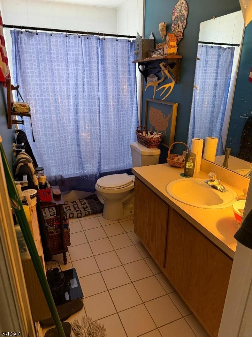 920 Plymouth Road North Brunswick, NJ 08902 - Photo 10 of 13 a bathroom with a sink and a toilet