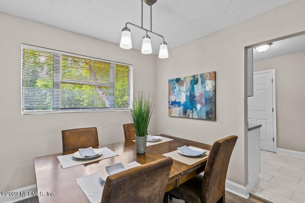 2142 Benedict Road Jacksonville, FL 32209 - Photo 11 of 34 a dining room with furniture and window