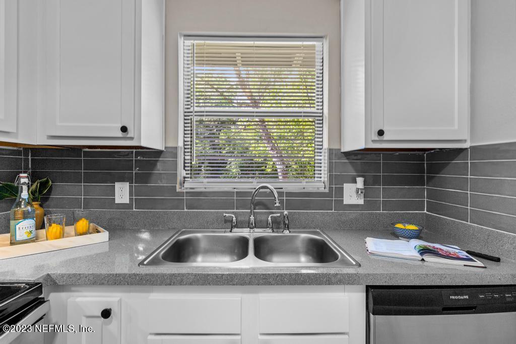 2142 Benedict Road Jacksonville, FL 32209 - Photo 16 of 34 a kitchen with a sink and a window