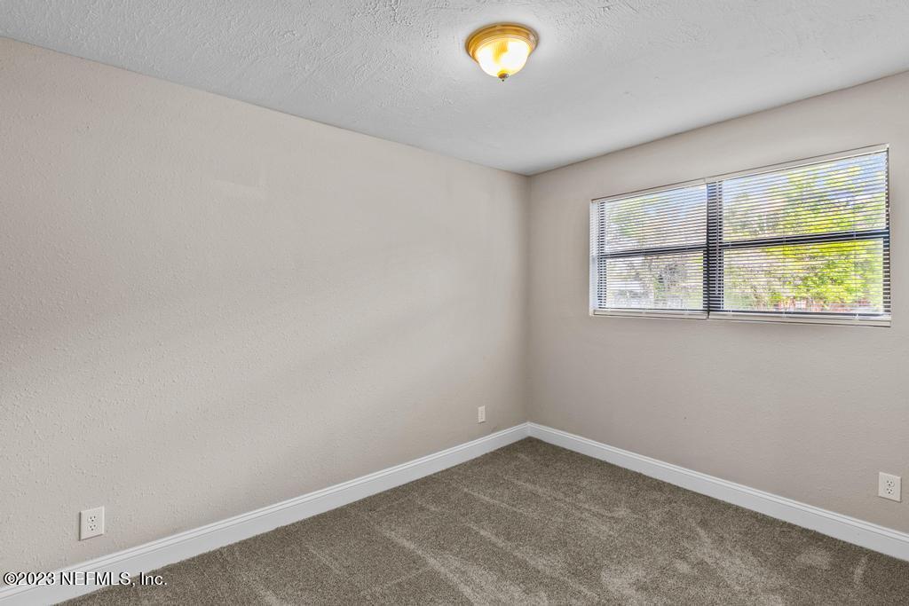 2142 Benedict Road Jacksonville, FL 32209 - Photo 24 of 34 an empty room with a window