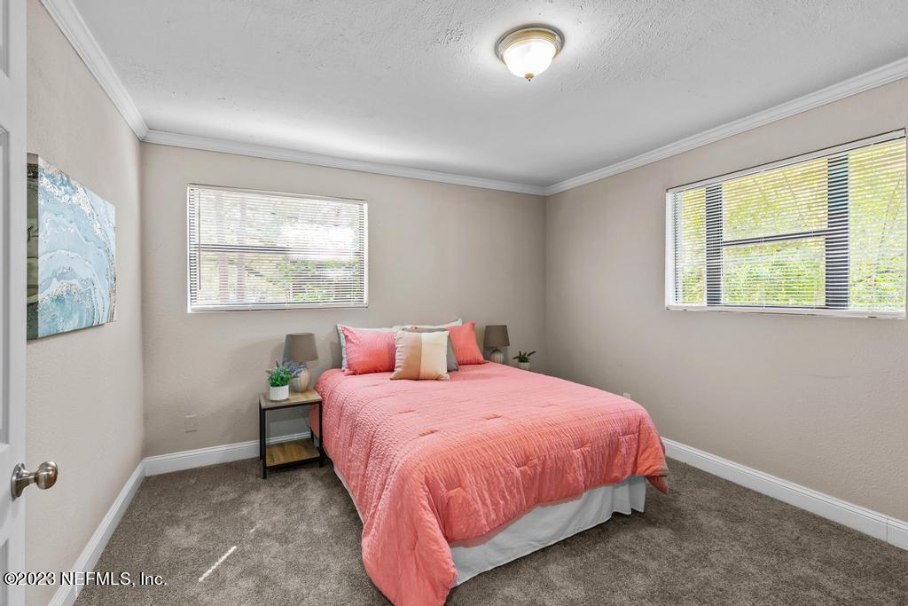 2142 Benedict Road Jacksonville, FL 32209 - Photo 28 of 34 a bedroom with a bed and a window