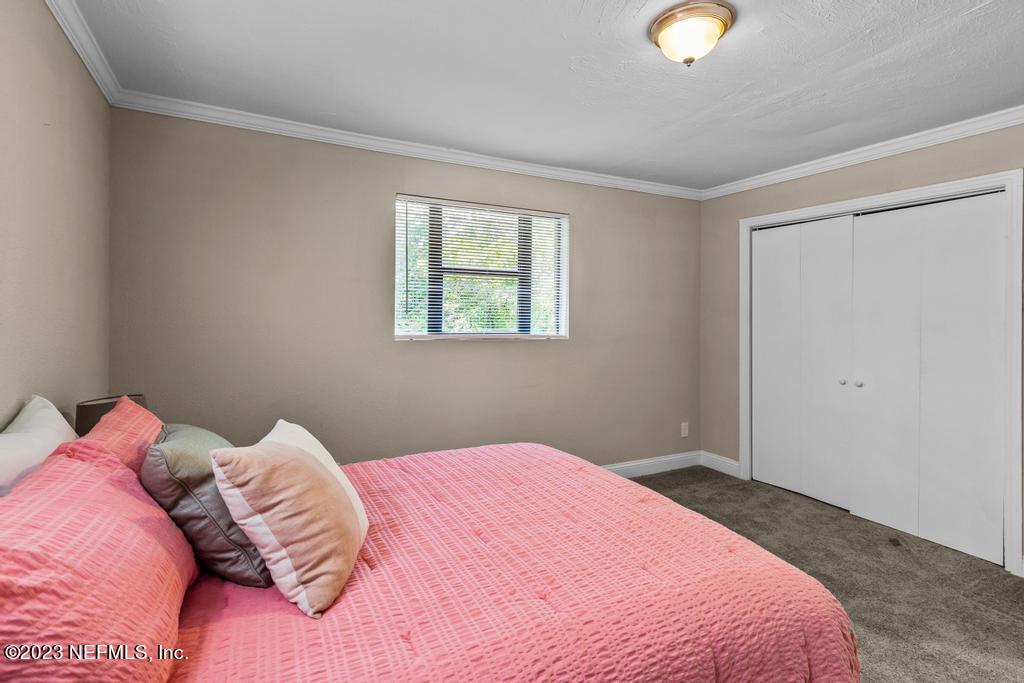 2142 Benedict Road Jacksonville, FL 32209 - Photo 29 of 34 a bedroom with a bed and a window
