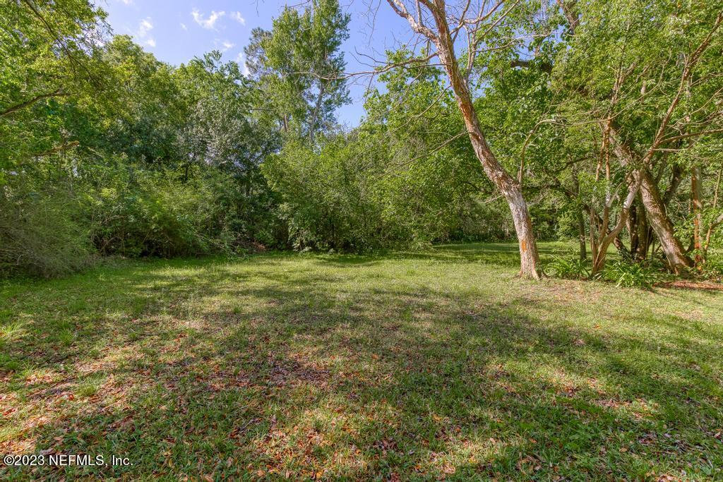 2142 Benedict Road Jacksonville, FL 32209 - Photo 33 of 34 a view of outdoor space with trees all around