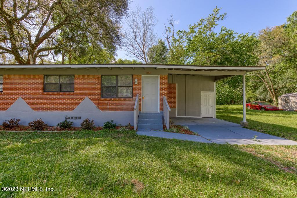 2142 Benedict Road Jacksonville, FL 32209 - Photo 4 of 34 front view of a house with a yard