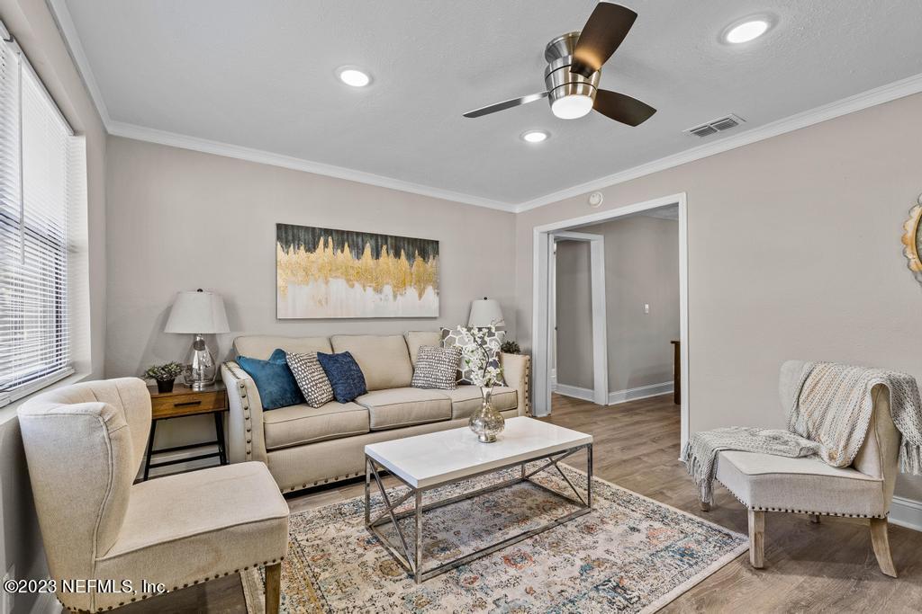 2142 Benedict Road Jacksonville, FL 32209 - Photo 7 of 34 a living room with furniture and a large window