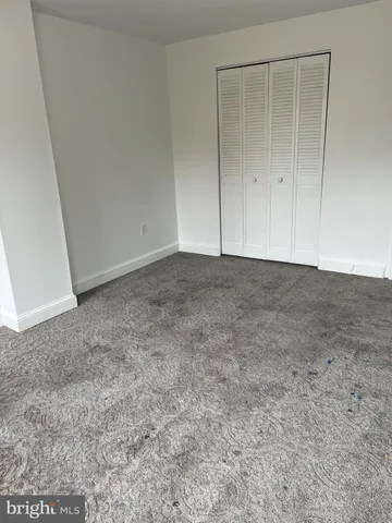 a view of an empty room and entryway