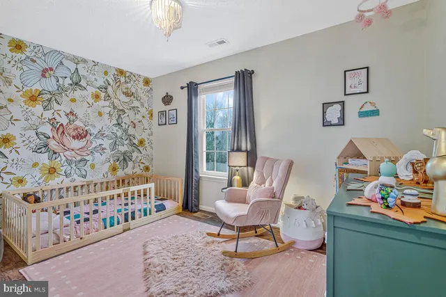 a living room with a couch and a chandelier